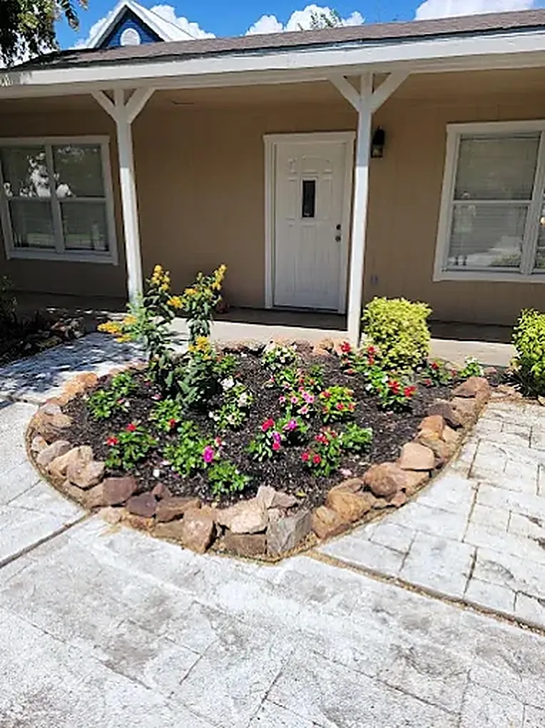 Front entry garden cared for by LBJ Gardens at a residential property in Kingsland, Texas near Lake LBJ