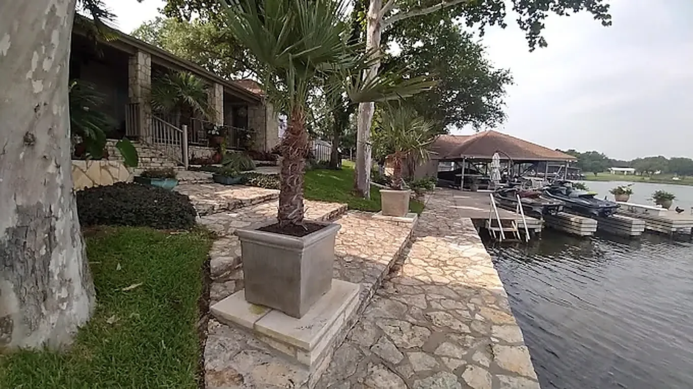 Lakeside landscape maintenance cared for by LBJ Gardens at a residential property in Kingsland, Texas near Lake LBJ